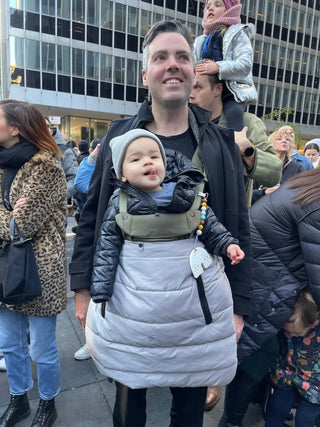 Parent using Cool Grey Carrier Cozy with baby carrier