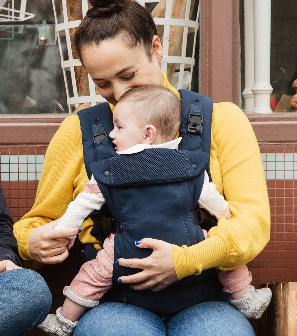 The Baby Carrier, Navy being worn by a parent