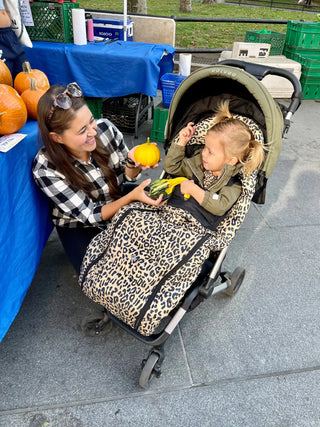 Parent using Wild Child Cozy on stroller