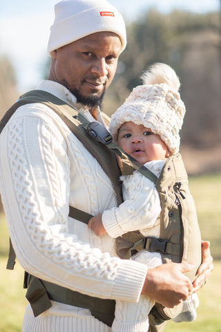 The Baby Carrier, Olive being worn by a parent